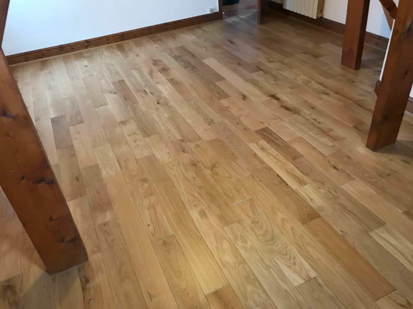 Plaatsing van 50 m² massief parket met akoestische onderlaag